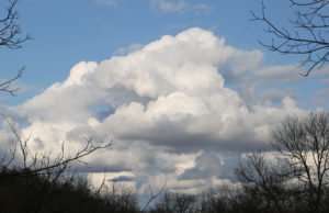 Ozark Sky in March photo by Gail E Rowley clouds in Ozarks over creek valley