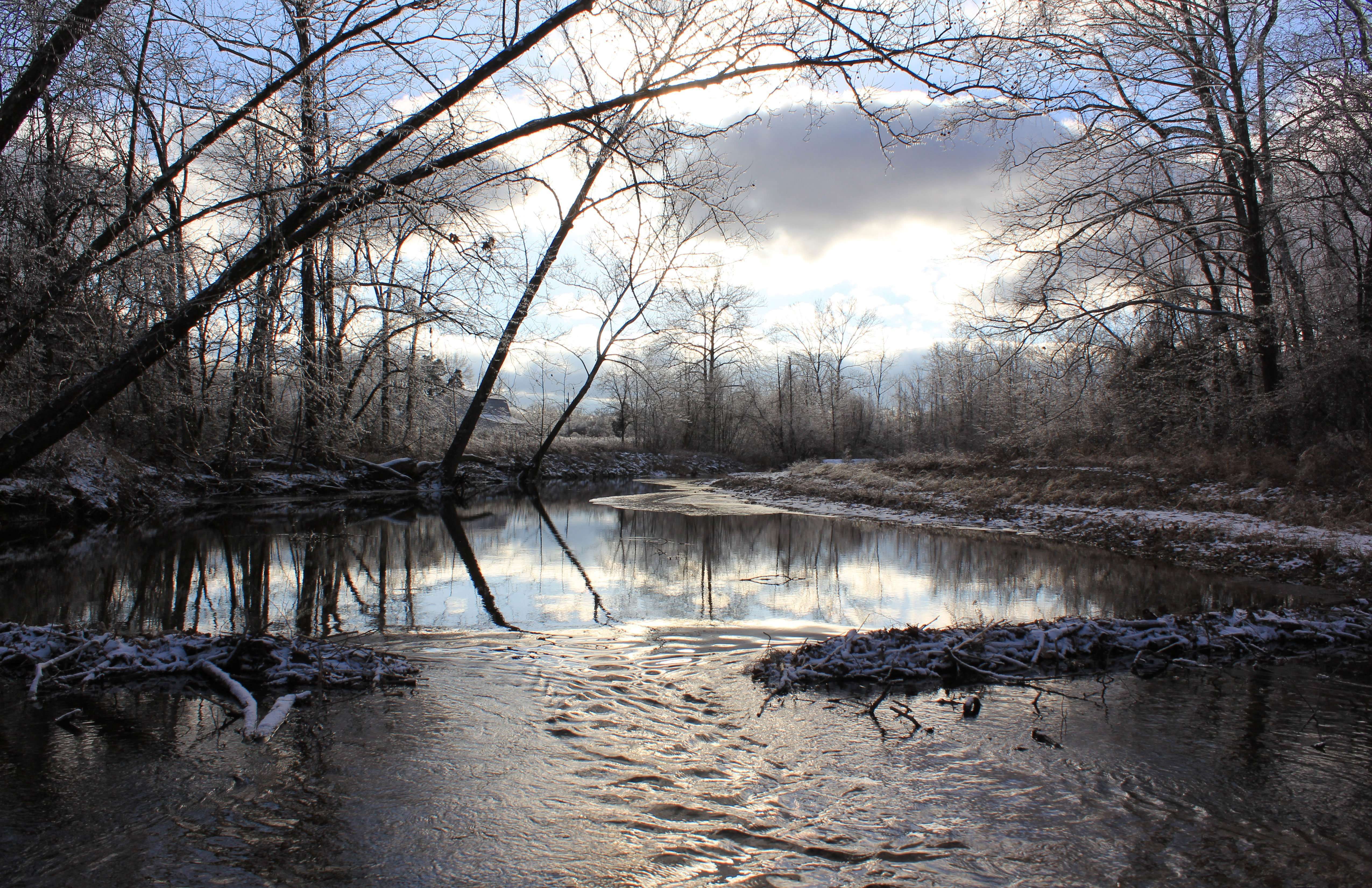 beaver dam on Ozark creek on icy January evening photo by Gail E Rowley Ozark Stream Photography